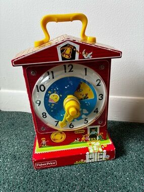 Fisher-Price Red Schoolhouse Musical Teaching Clock Toy - Yellow Handle